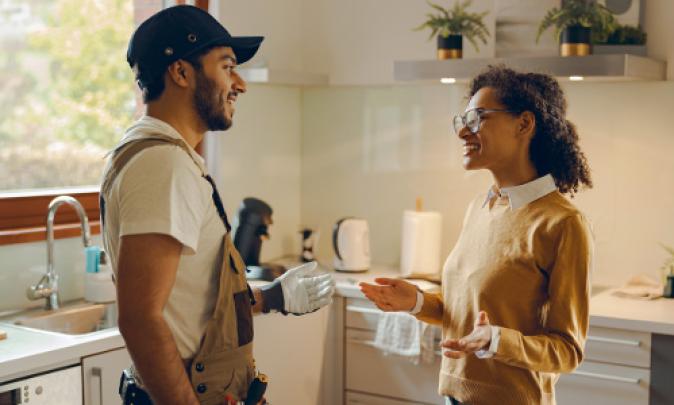 Contractor speaking with a home owner.